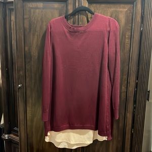 Maroon sweater with tan crêpe layered look.